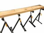 Roller Stand, telescopic roller stand, roller stand holding plank of wood
