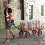 FM-CART garden trolley cart carrying log bags on rough ground